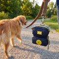 Leash Bag with Waste and Treat Pockets clipped onto a leash outdoors